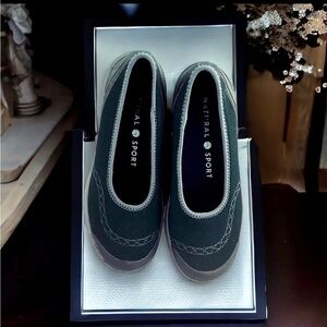 Natural Sport slip on navy blue flats.